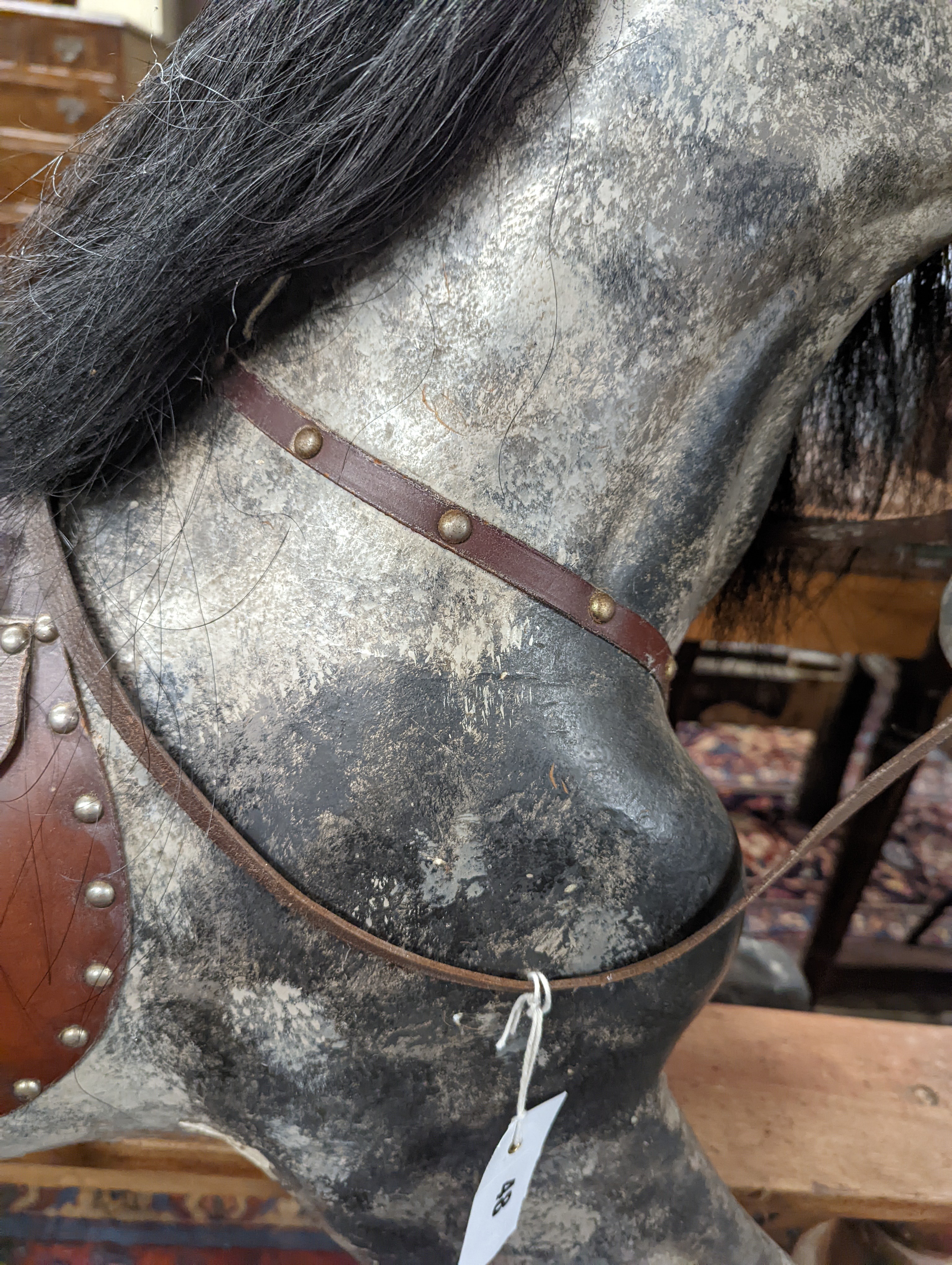 A large Edwardian Ayres type rocking horse on a turned safety frame, length 160cm, height 110cm